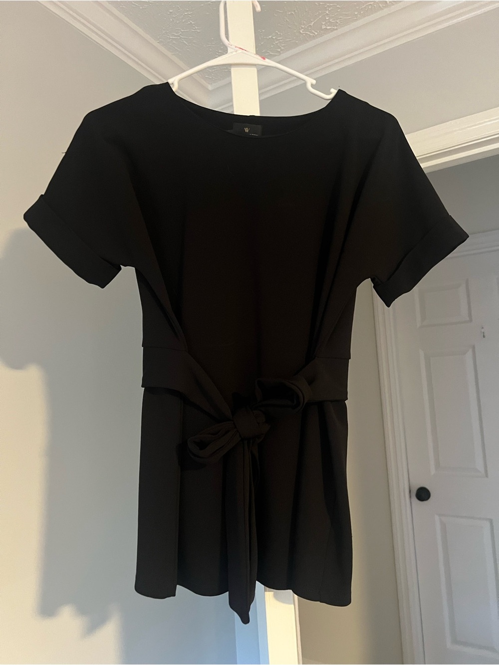 Black dress blouse with tie waist.